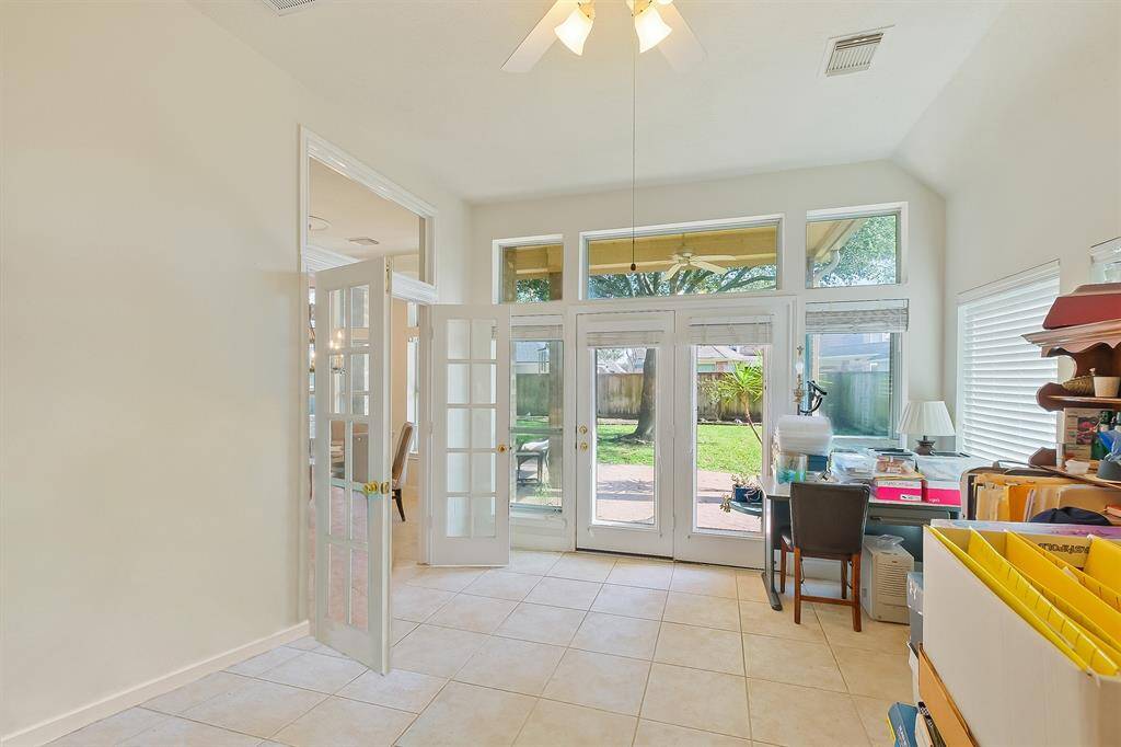 ENJOY A SEAMLESS INDOOR-OUTDOOR EXPERIENCE IN THE GAMEROOM WITH DIRECT ACCESS TI THE BREAKFAST AREA AND PATIO, PERFECT FOR HOSTING GATHERINGS.