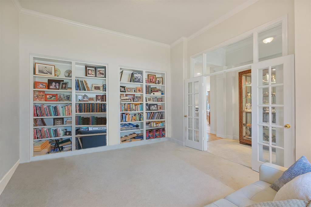 BUILT-IN BOOK SHELVESYOUR STUDY INCLUDESFRENCH DOORS FOR ADDEDPRIVACY.