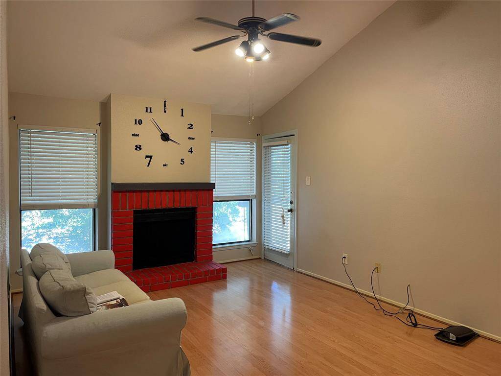 Spacious living room featuring soaring high ceilings