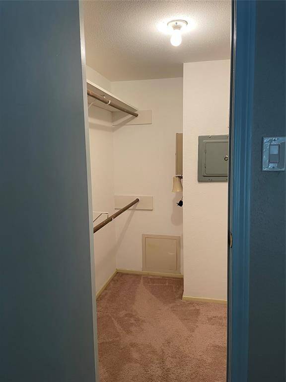 Spacious walk-in closet in bedroom