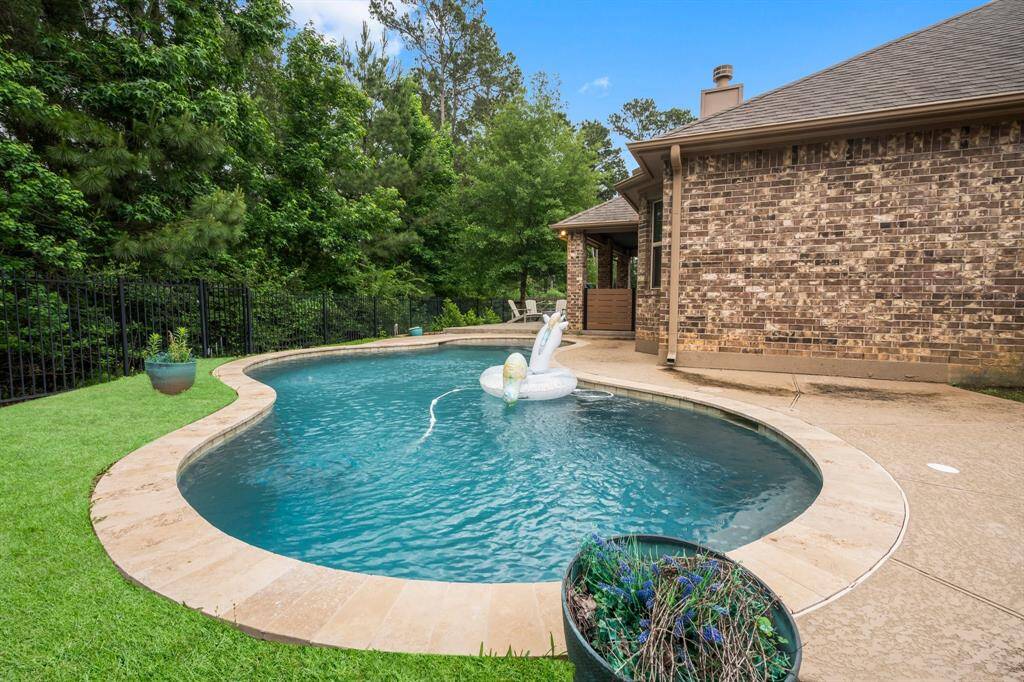 Just what the doctor ordered for perfect spring afternoons and long summer days! This amazing pool features two seating and sunning areas, plus a sun deck for ultimate relaxation. Towering trees provide shade and privacy, creating a peaceful backyard retreat you’ll love to enjoy!