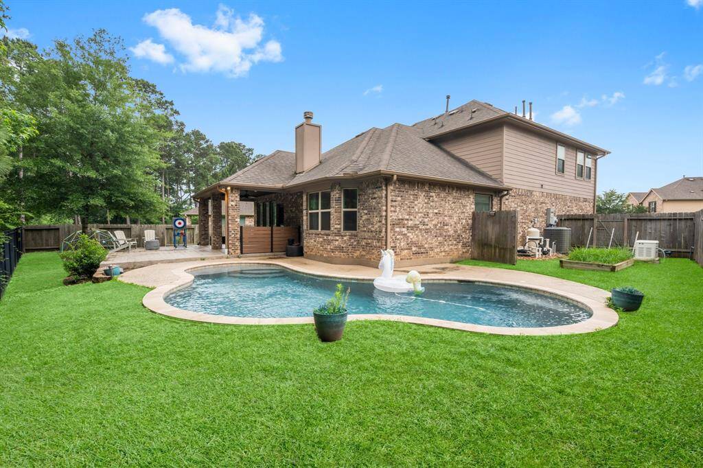 Live like you are on vacation in this backyard oasis. The sparkling pool, extended patio for dining, the deep covered porch with ceiling fan for lounging – it’s all here!