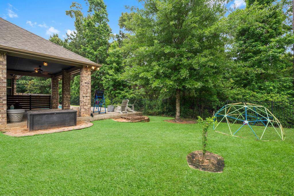 There is also plenty of greenspace for play.  For a closer look at the beautiful backyard, view the walk-through video by clicking the movie reel icon or refer to the online documents for more details.