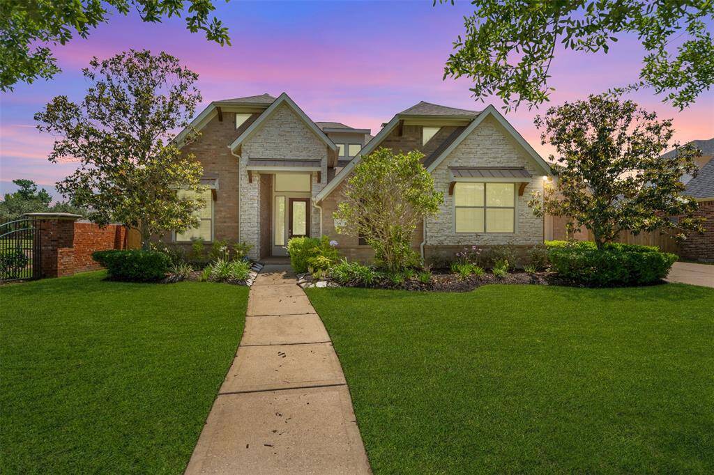 Welcome to this beautiful brick home with manicured landscaping, mature trees, and charming curb appeal on a quiet, well-kept street.