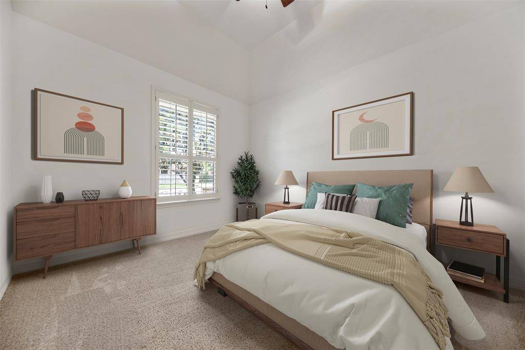 The fourth bedroom features elegant shutter-style windows, soaring high ceilings, and a refined neutral color palette. It includes a luxurious ensuite bath, offering both privacy and sophistication.(This photo is virtually staged)