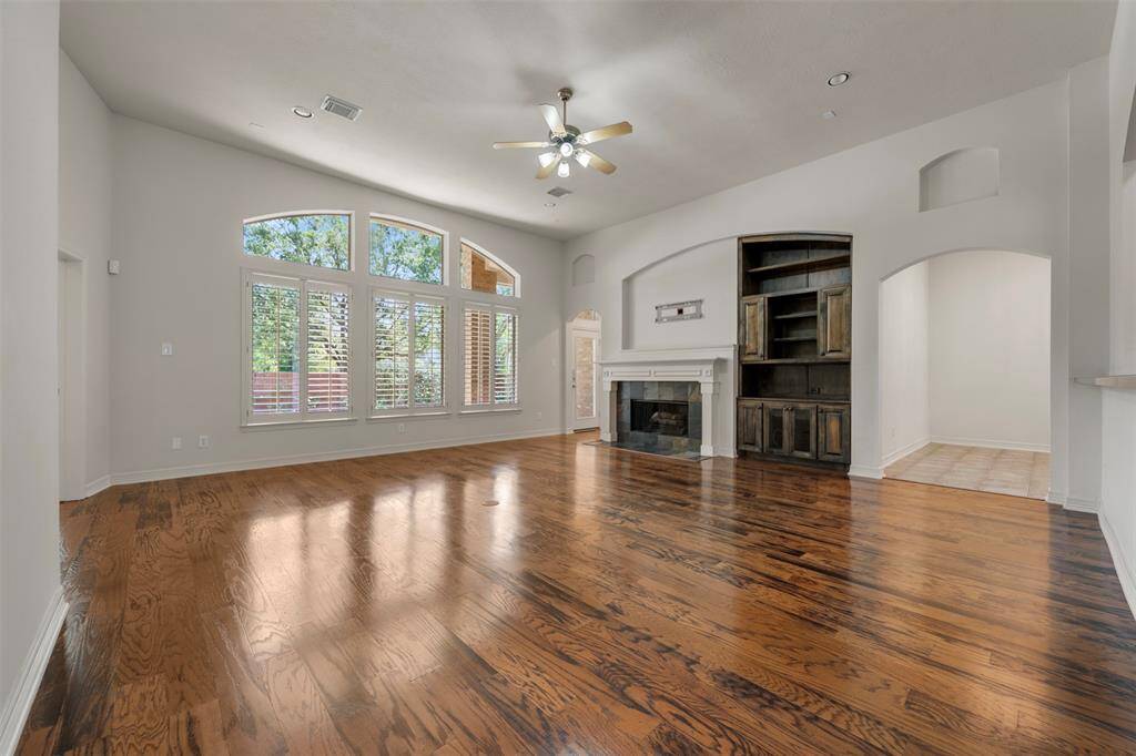 From the living room, enjoy views of the elegant fireplace and the effortless flow into the bright eat-in kitchen, creating a warm and connected space ideal for gathering.