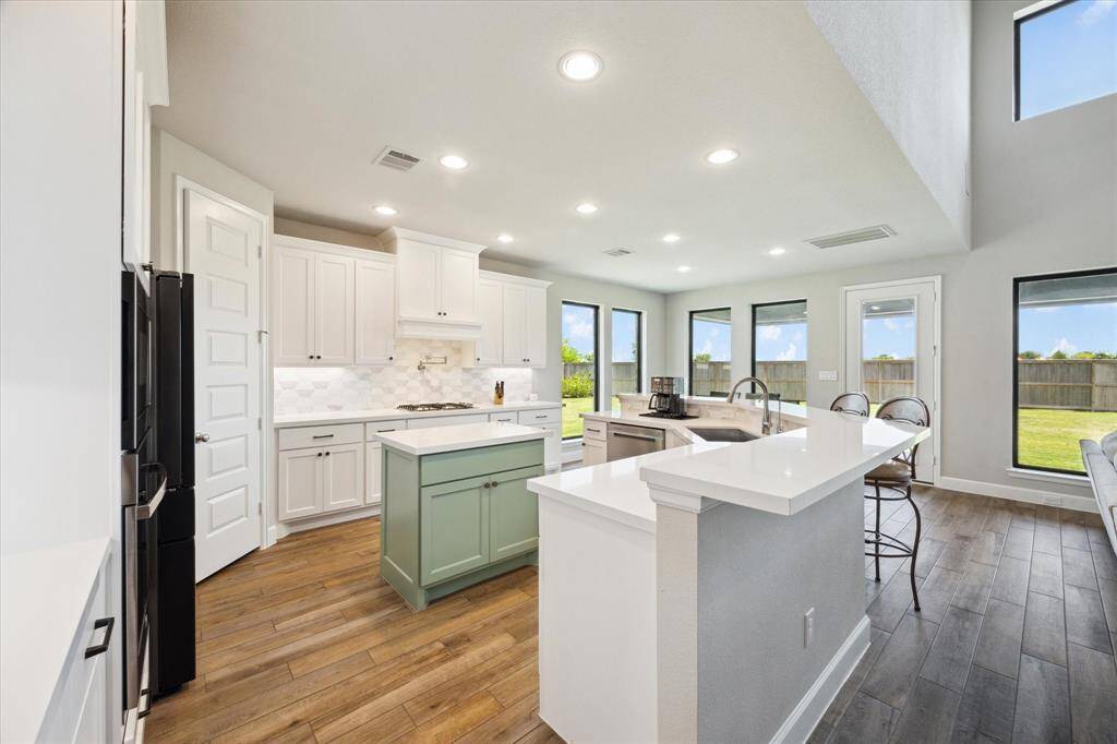 The kitchen island provides a pop of color!
