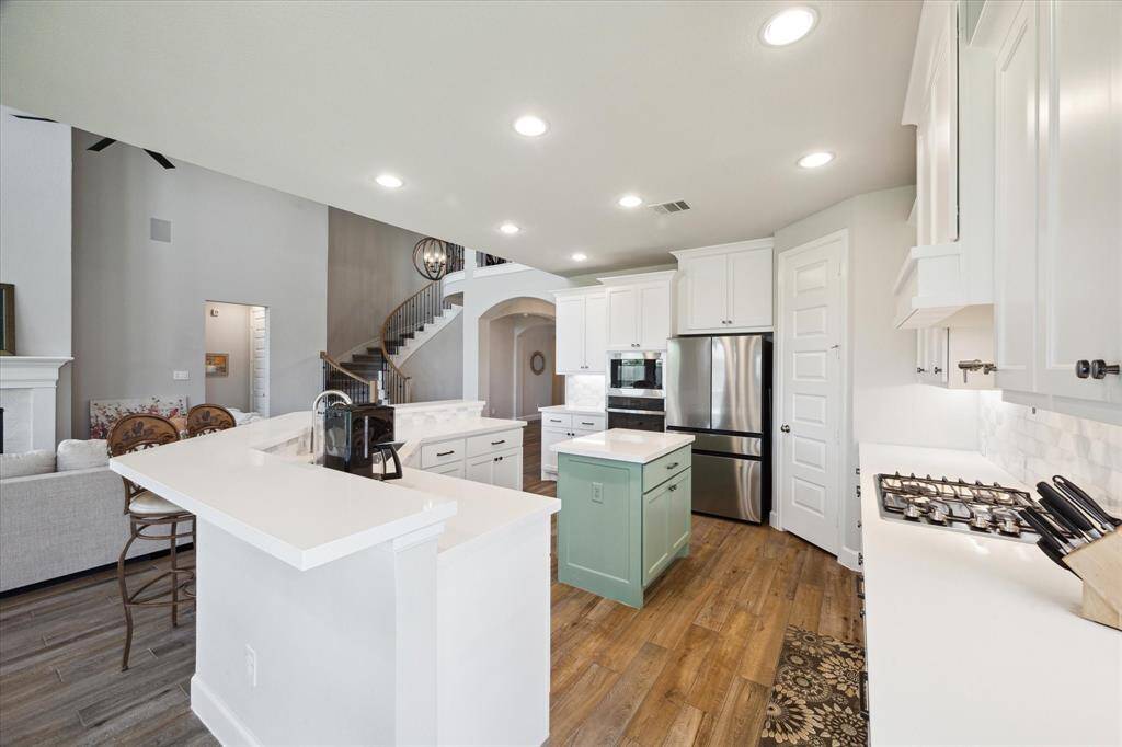 Under cabinet lighting enhances your kitchen workspace.