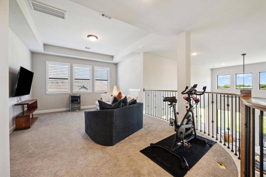 Game room with room for your treadmill and maybe a pool table.