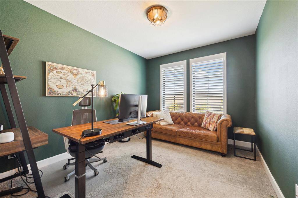 This upstairs bedroom is being utilized as an office.
