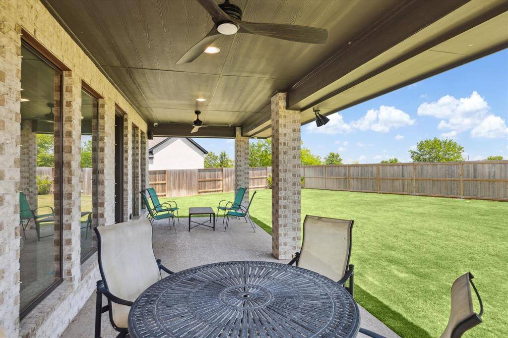An extended covered back patio provides room for seating.