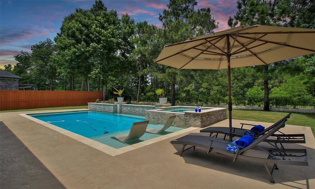 Your backyard paradise is waiting for you, compete with Heated pool, hot tub and on a Greenbelt.