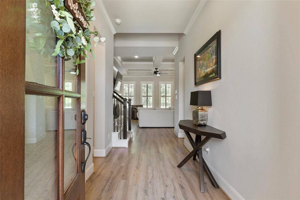 As you enter the home you are welcomed to an open entry with the study to the left of the front door.