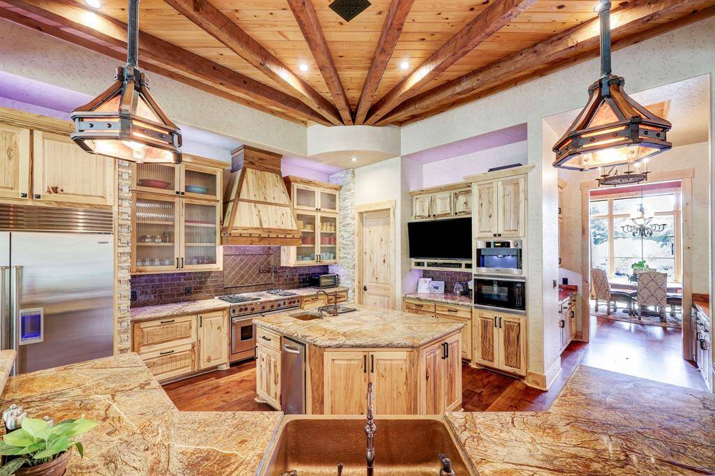 The kitchen includes a built in steamer, professional coffee maker, and trash compactor.