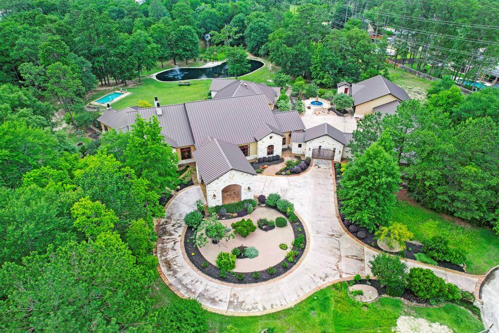 On over 8 acres, this ranch style home provides the perfect escape while still being a short distance to downtown Houston.