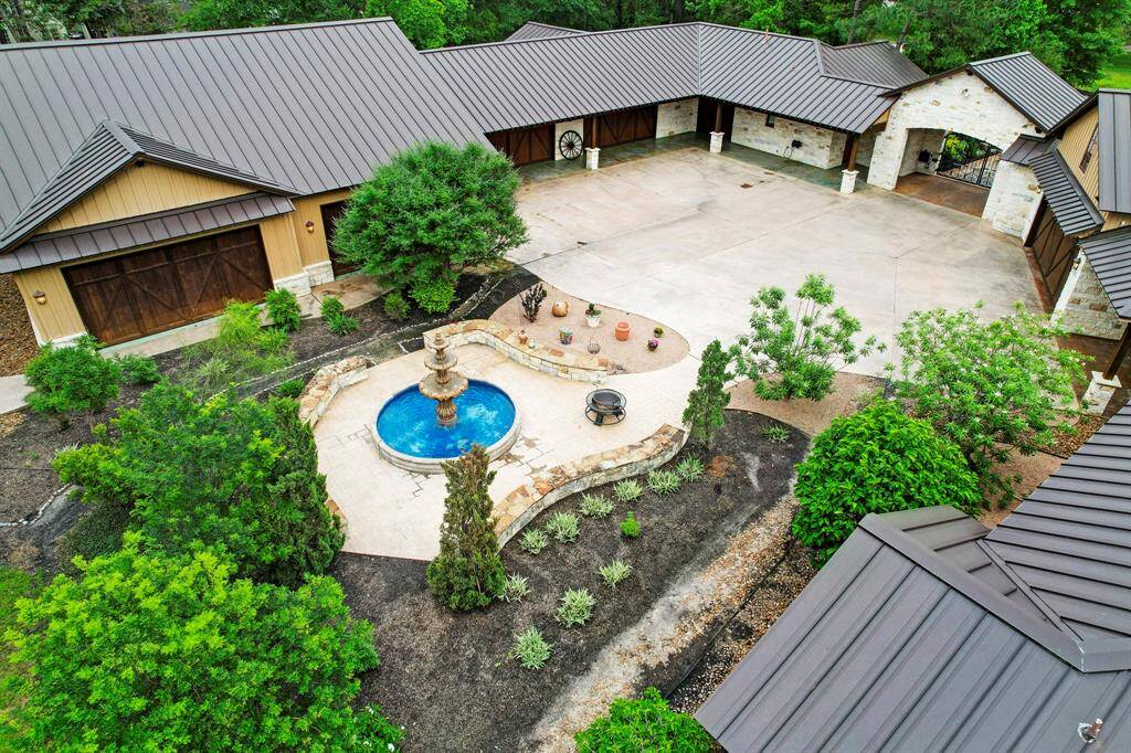 The garage area includes a 10 car garage, indoor basketball court, casita, and fountain.