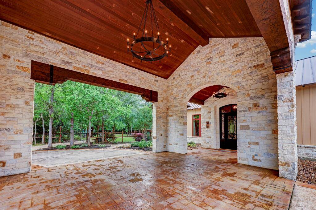 The porte-cochère includes a custom built iron chandelier.