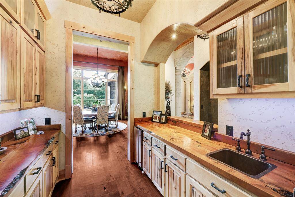 The wet bar seamlessly blends the formal dining room and the kitchen.