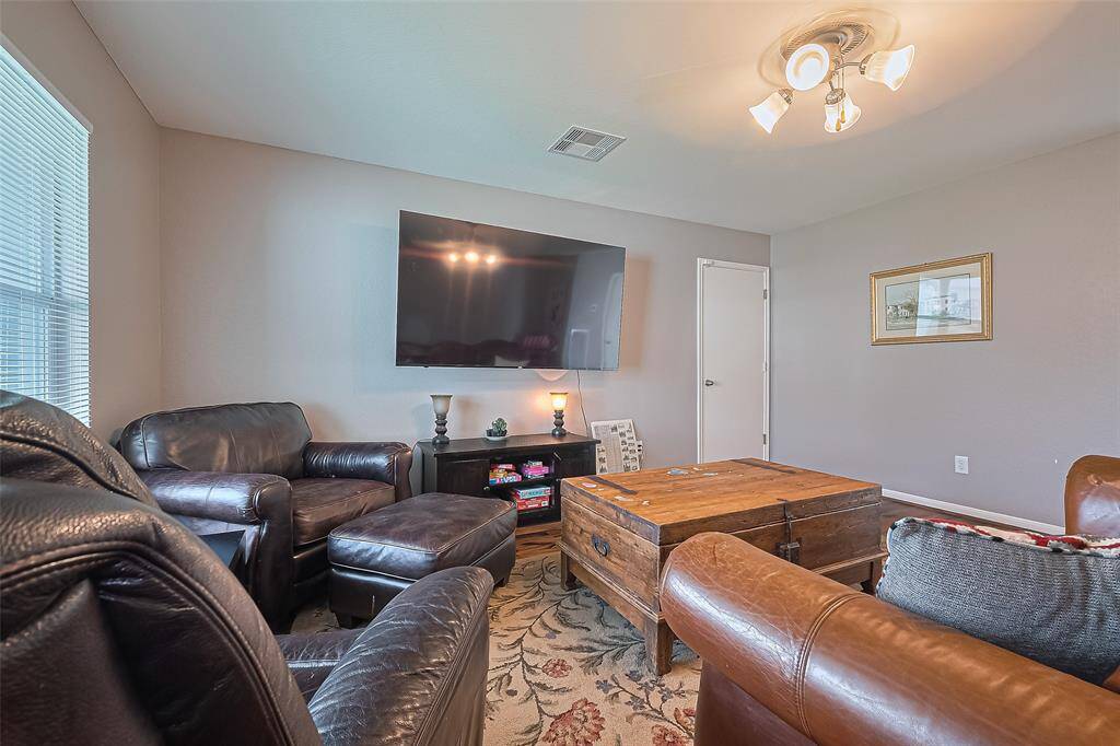 The spacious 15x16 SF living room has overhead lighting.