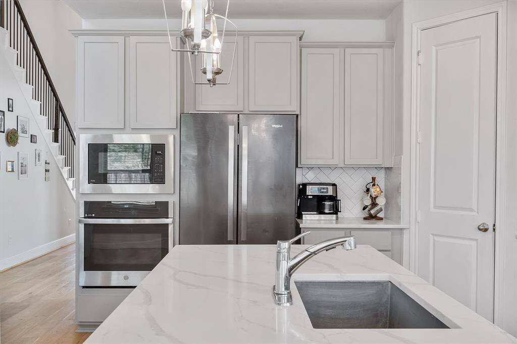 Gourmet chef's kitchen with soft close cabinets, stylish range good and serving island