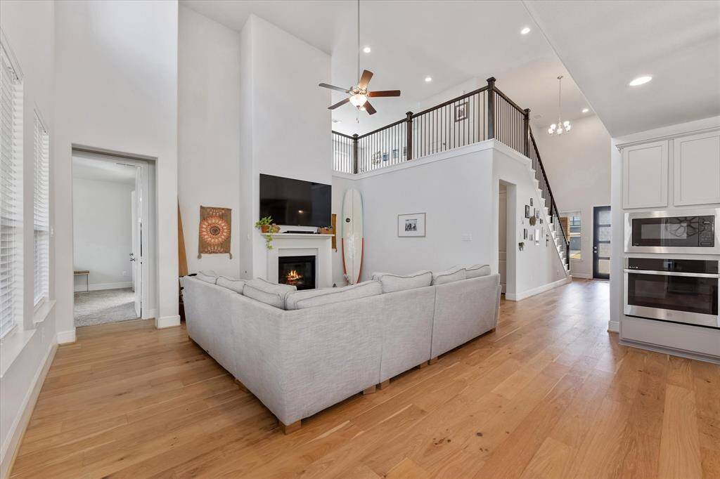 Expansive open living/kitchen floor plan with 18ft ceilings