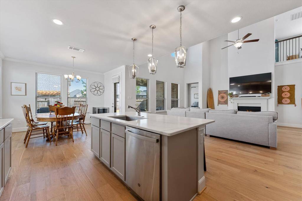 Gourmet chef's kitchen with soft close cabinets, stylish range good and serving island