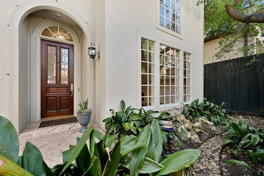 Beautiful front entry surrounded by lush landscaping!
