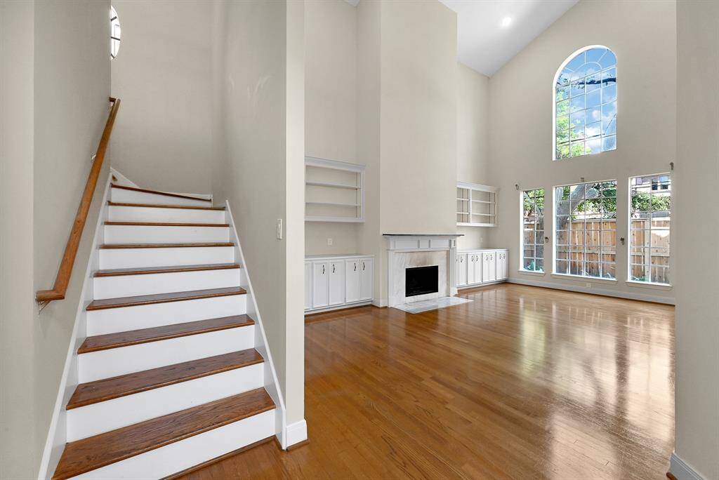 Amazing and spacious downstairs living area with high ceilings and floor to ceiling windows which bathe the home in natural light!