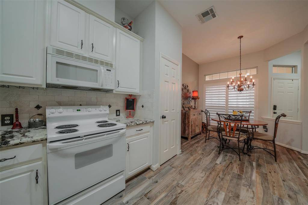 View from the opposite side of the kitchen towards the entrance.