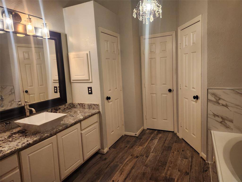 Spa like primary bathroom with walk in closet.