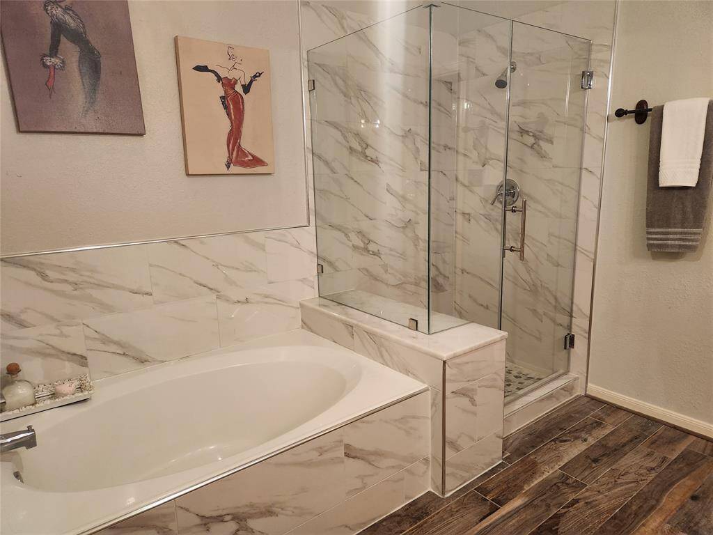 Master bath includes large soaker tub and separate shower.