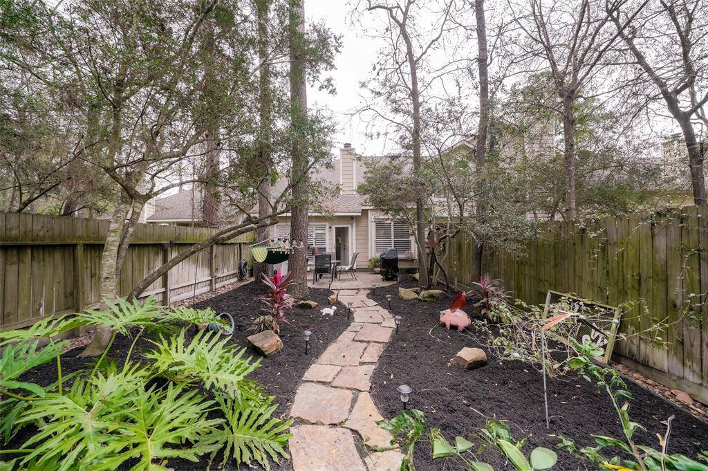 Home features a nice size fenced backyard that has lots of artistic pieces and night time lighting and mosquito control.