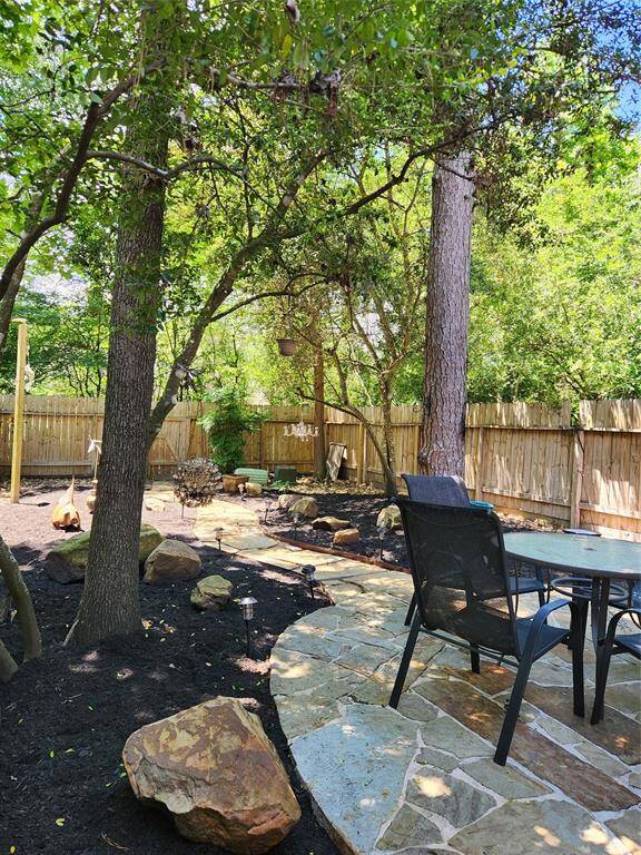 Private backyard area with no maintenance. Back gate leads to walking trails.