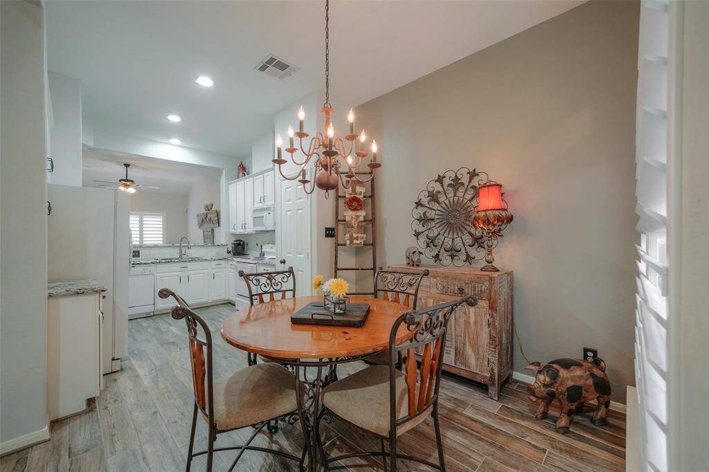 Dining table and all decor items included in this furnished lease.