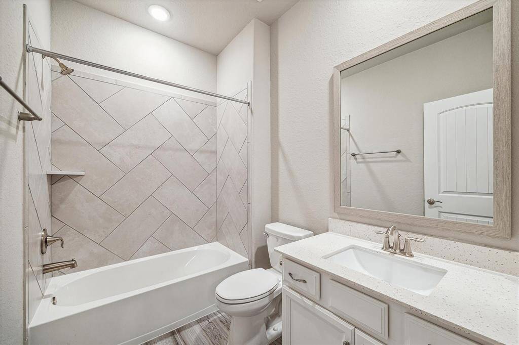 Upgraded wood look tile throughout the home; the perfect balance between durability and style.