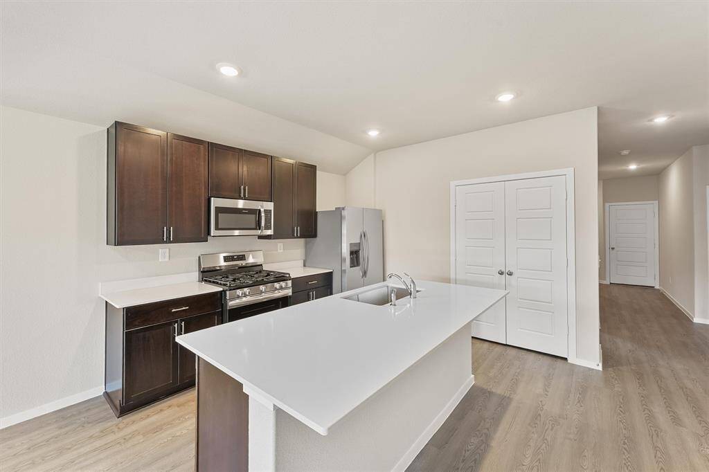 a modern open-concept kitchen and living area.