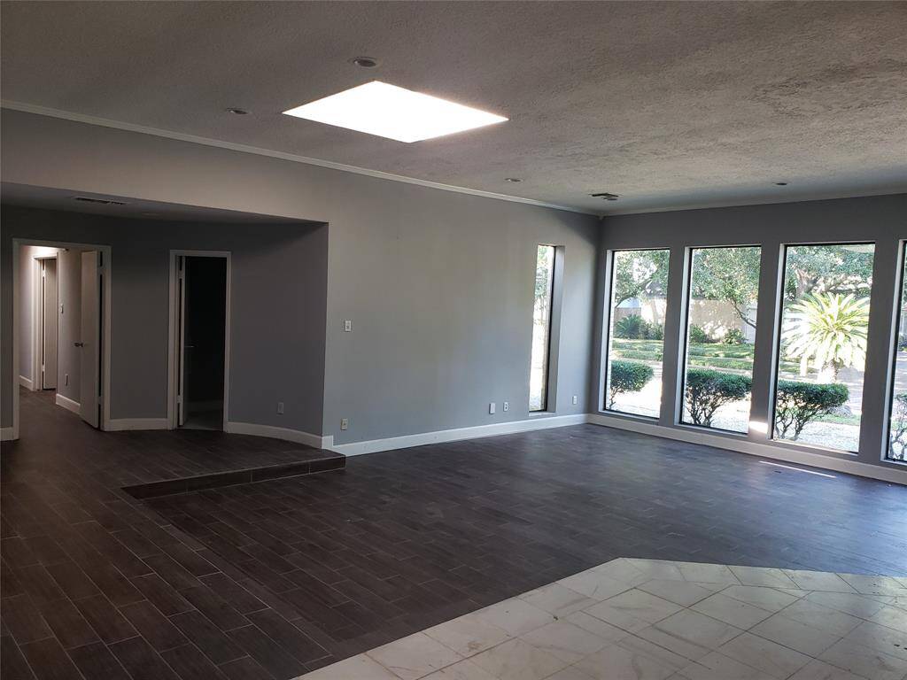 Living area leading to bedroom(s) wing