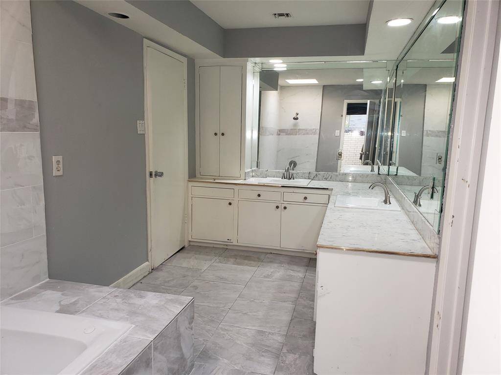 Hall bath has adjoining bedroom