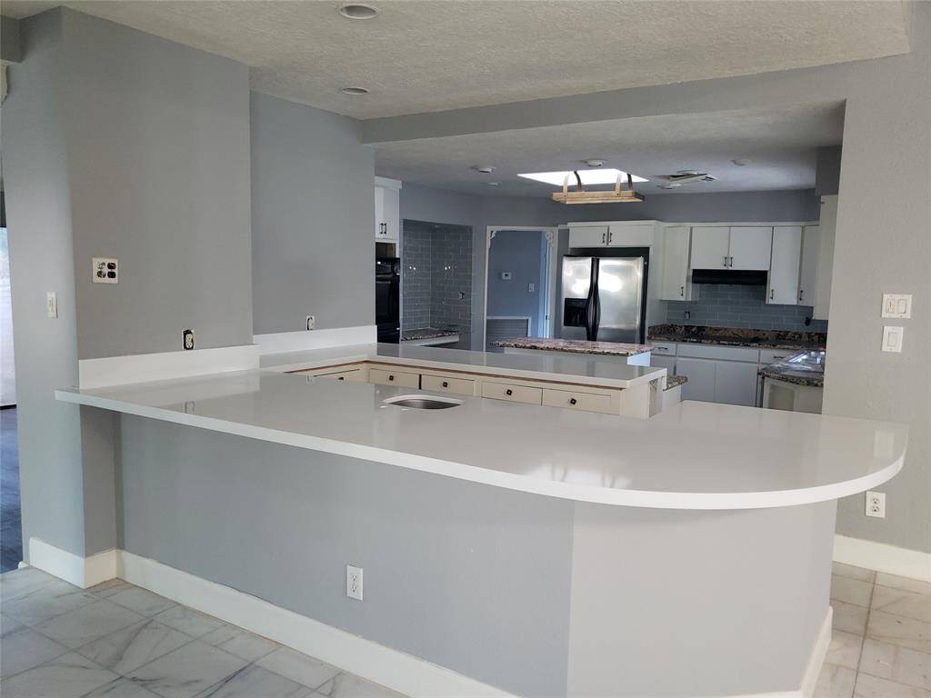Open kitchen from the walk in bar