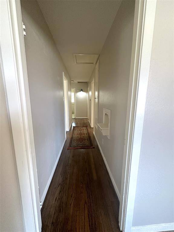 Primary bedroom is separated from the other two bedrooms by the bathroom.