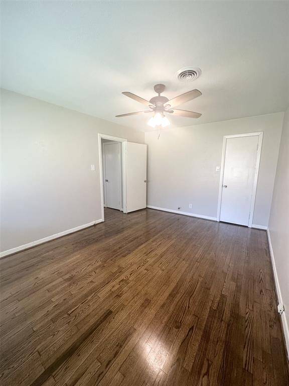 Primary bedroom is separated from the other two bedrooms by the bathroom.