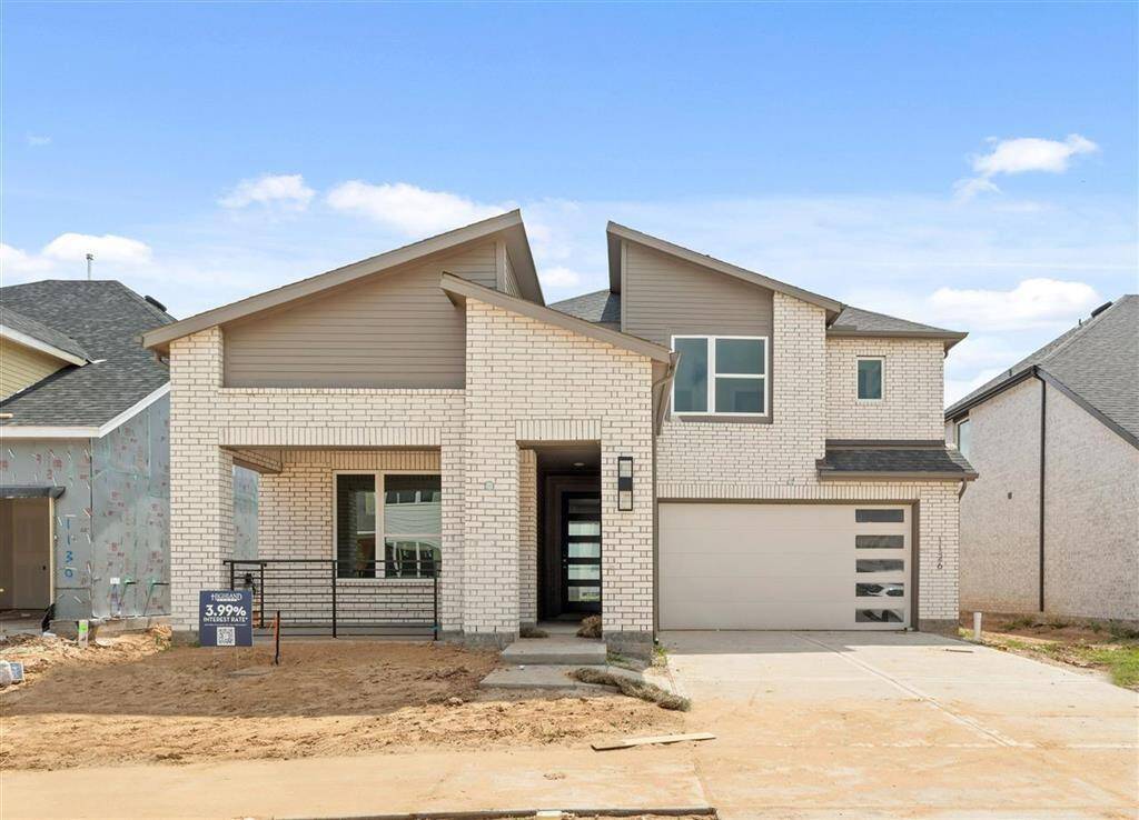 A welcoming front porch invites you to relax and enjoy the view