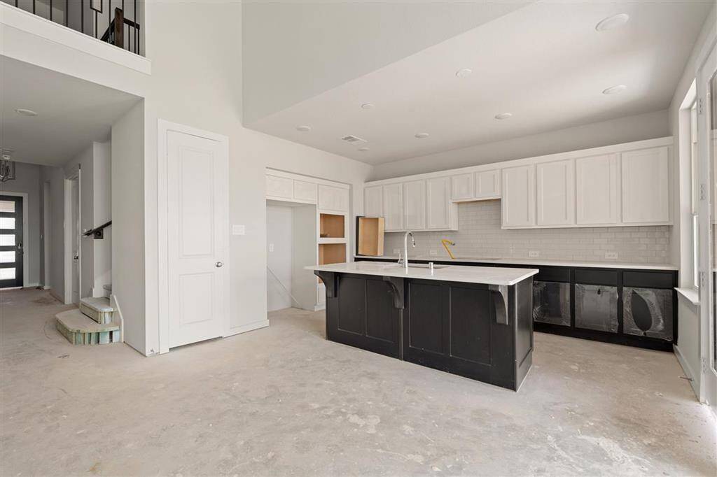 Modern elegance meets timeless design in this open-concept kitchen