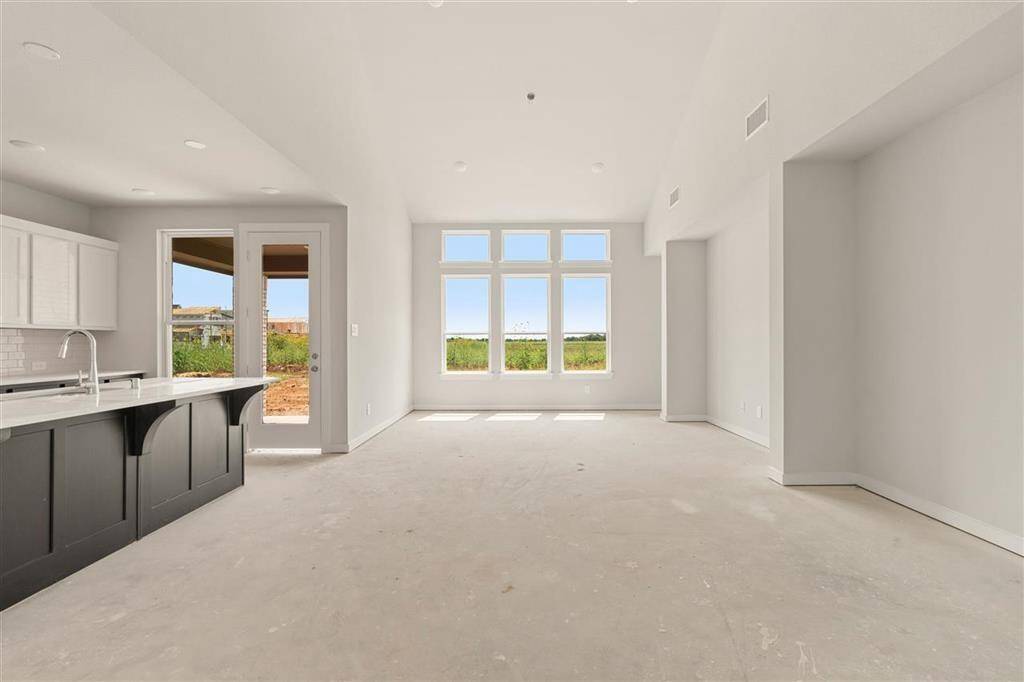 Blurring the lines between cooking, dining, and relaxing-this open-concept space is designed for living