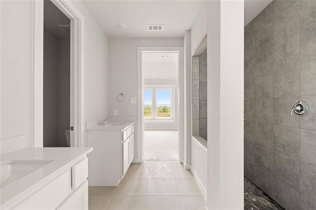 This bathrooms sleek design and calming colors create the perfect environment for relaxation