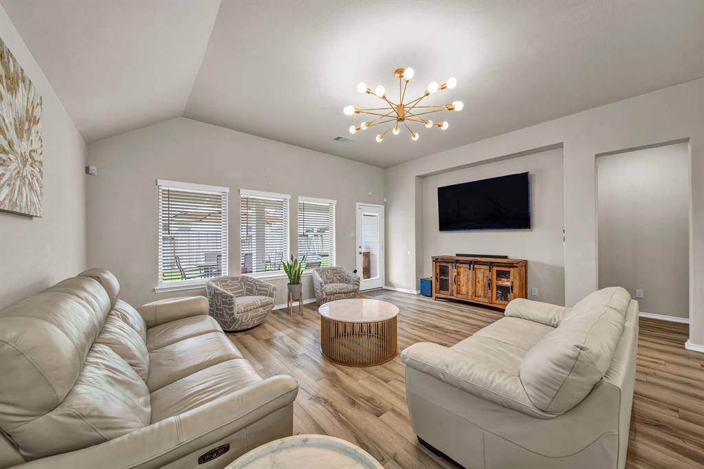 Living room facing TV wall with neutral tones and natural light.