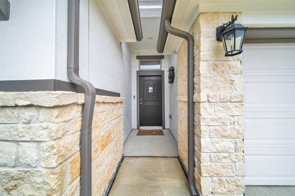 Covered front entry with stone accents