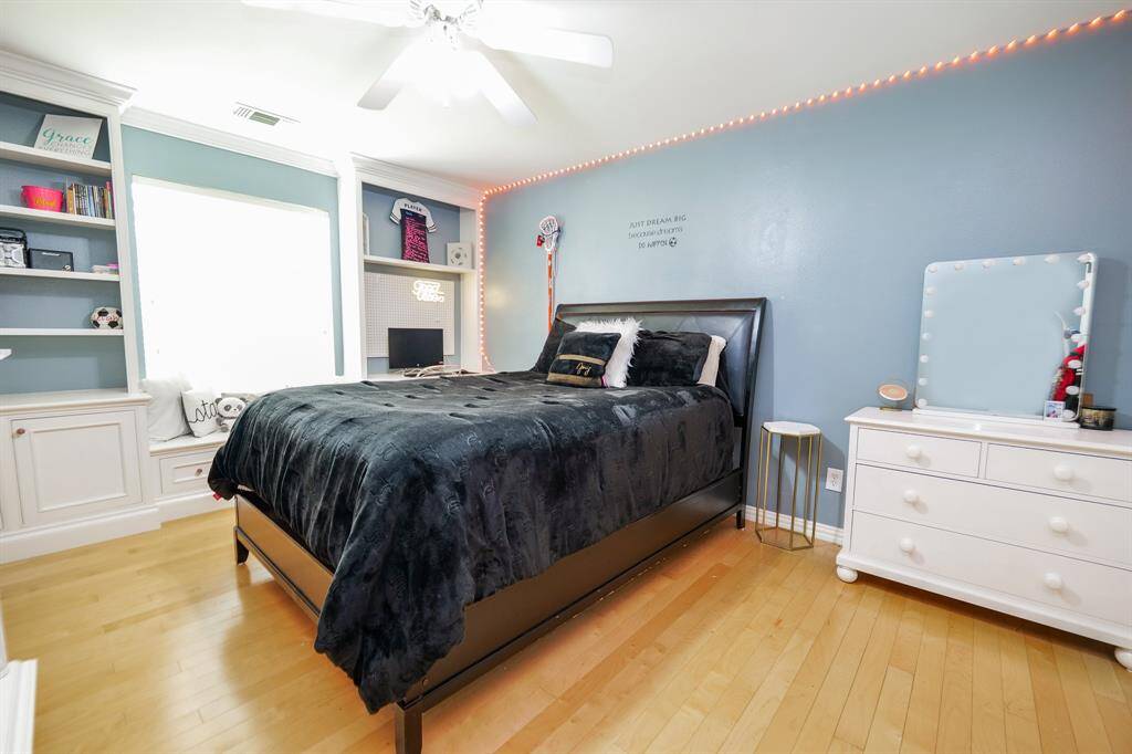 The oversized secondary bedroom offers plenty of space for a queen-sized bed, additional furniture, and features abundant natural light and generous closet storage.