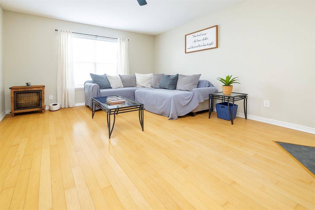 The oversized secondary living room offers ample space to accommodate an oversized couch, making it the perfect spot for comfortable lounging and family gatherings.