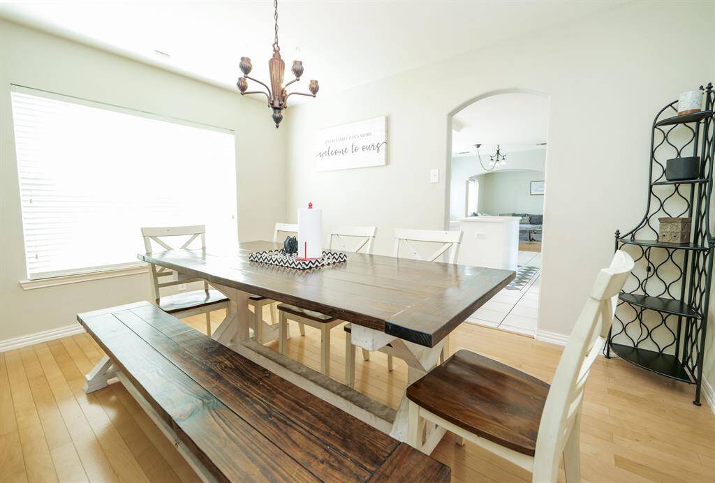 The dining room effortlessly connects to the kitchen, offering a functional and open layout ideal for both casual meals and entertaining.